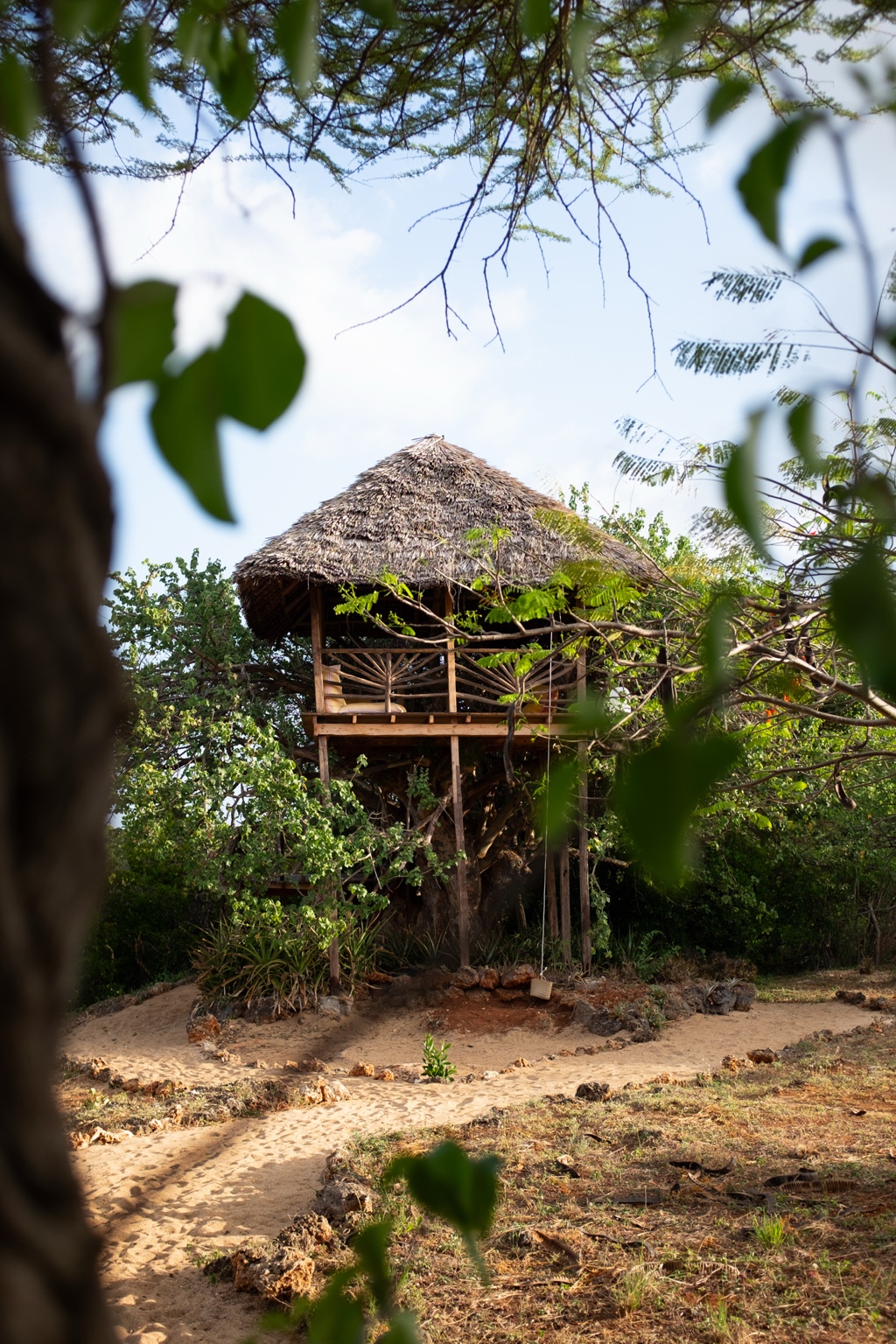 Treehouse surrounded by mature trees in the garden at Mkoko on Manda Island