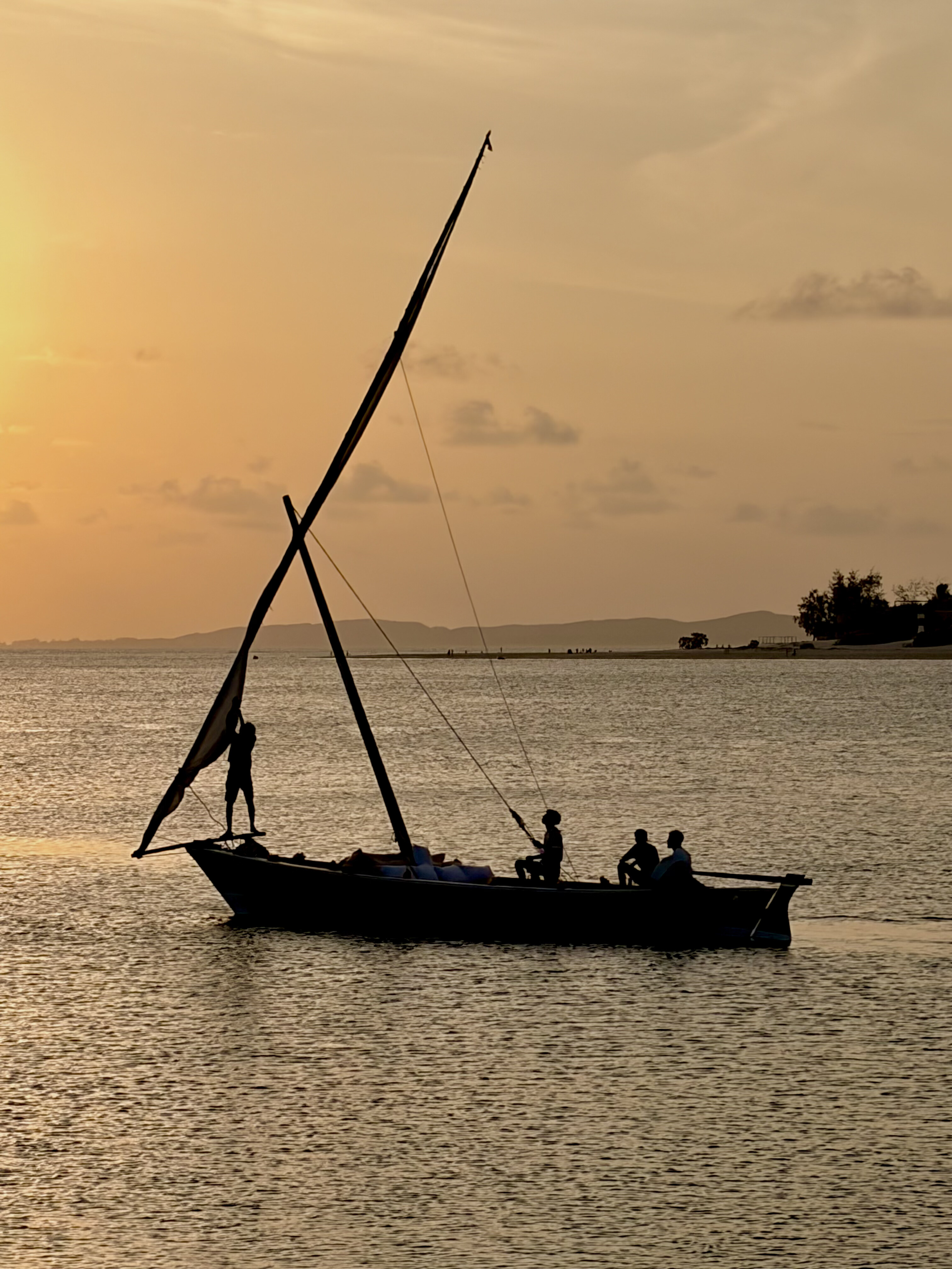 Sunset over the water at Manda beach